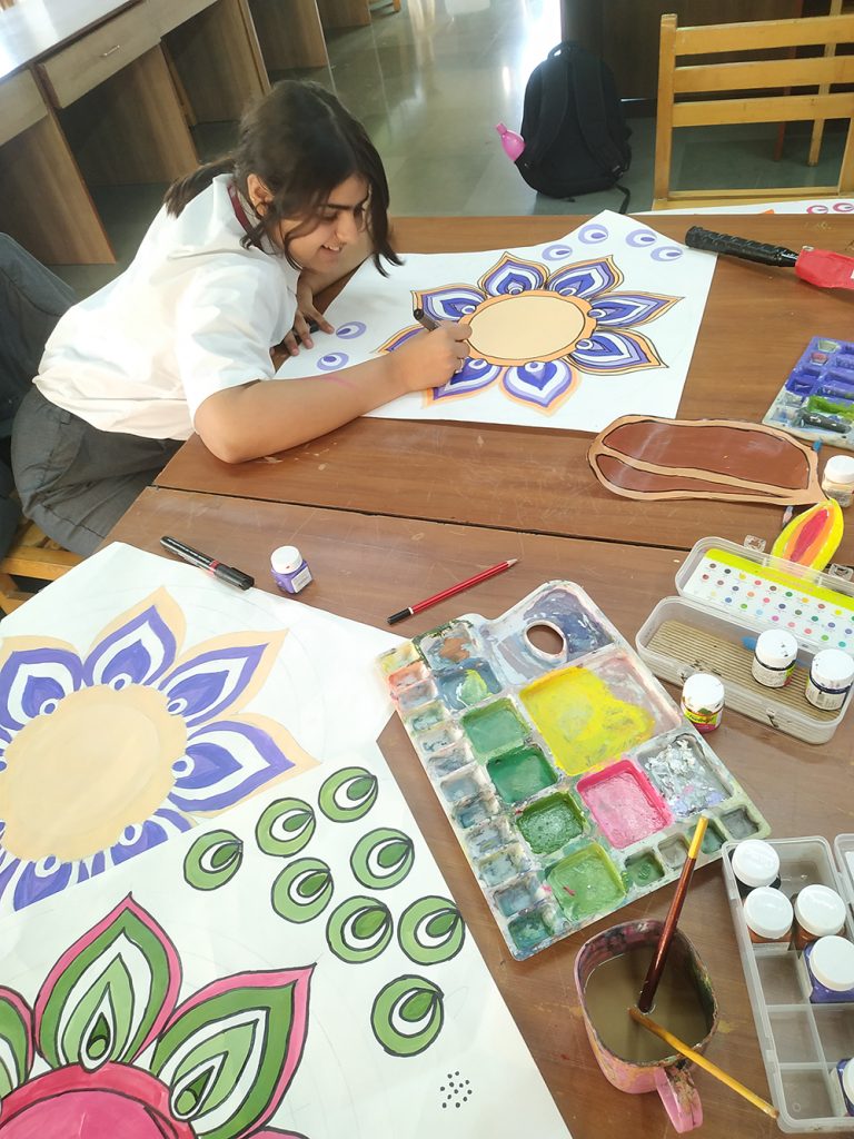 Student working on diwali painting